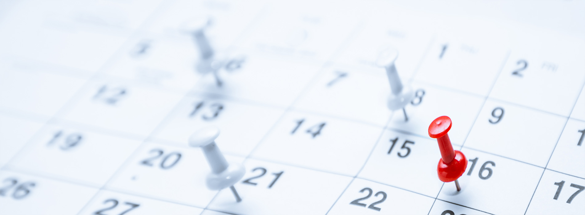 The image shows a close-up of a calendar with the date 16 highlighted, indicating an upcoming event or appointment.
